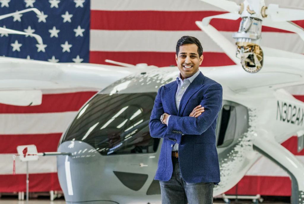 Archer's new CCO Nikhil Goel stands in front of the Midnight eVTOL