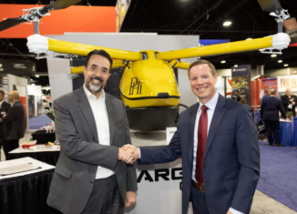 Kaman PHI representatives agreement at HAI Heli-Expo